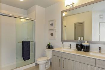 Double Sink Vanities & Glass Showers or Soaking Tubs at Aurora Luxury Apartments in Downtown Tampa FL